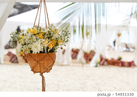 Hanging flower vase decorated at the beach Hanging flower vase decorated at the beach 54931330