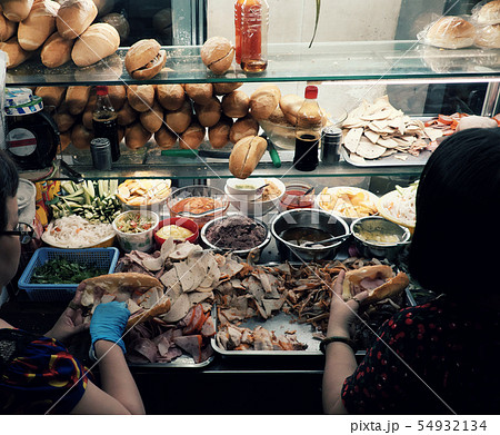 Vietnamese woman Vietnam bread night street food Vietnamese woman Vietnam bread night street food 54932134
