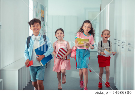Cheerful happy children feeling happy after finishing school day 54936380