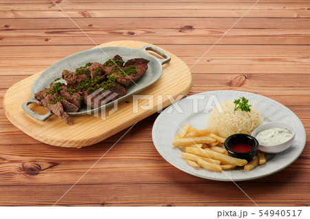 Barbecue steak on wooden table 54940517