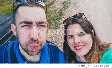 Happy young couple doing silly and funny faces 54940530