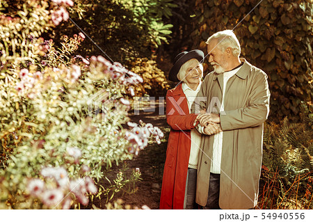 Happy elderly couple taking a stroll together. 54940556