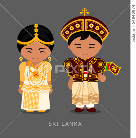 Sri Lankans in national dress with a flag. 54940974