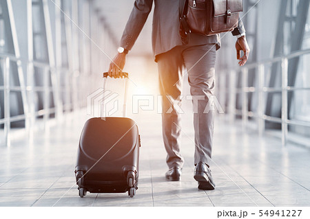Businessman Hurrying on Plane, Walking Through Passenger Bridge 54941227