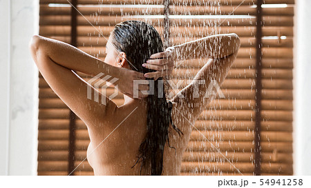 Sexy Woman Washing Long Hair Under Water Jet 54941258