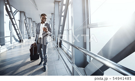 Move to Boarding Gate. Afro Businessman Carrying Baggage 54941485