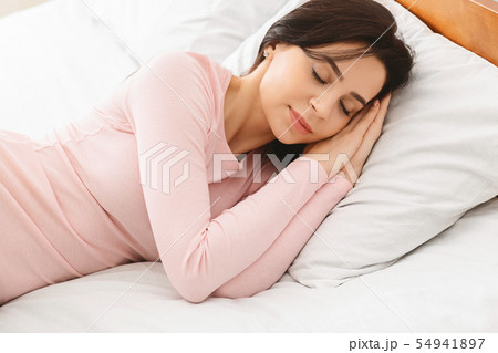 Beautiful young woman sleeping in her bed 54941897