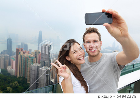 Hong Kong Victoria Peak tourists couple selfie Hong Kong Victoria Peak tourists couple selfie 54942278