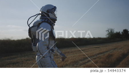 Man in space suit walking 54943374