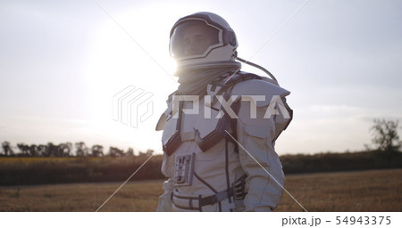Astronaut opening helmet on Mars 54943375