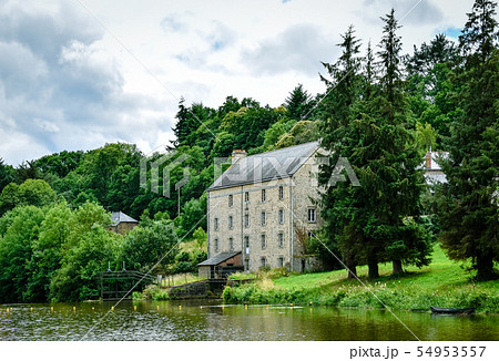 House and forest in the riverside. Green and House and forest in the riverside. Green and 54953557