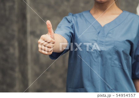 Nurse or doctor showing thumbs up finger. 54954557