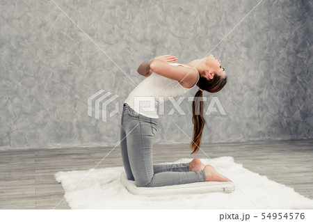 Young woman yoga on carpet at home living room. Young woman yoga on carpet at home living room. 54954576