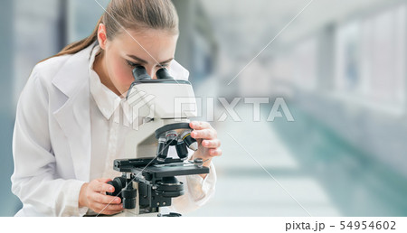 Scientist researcher uses microscope in laboratory Scientist researcher uses microscope in laboratory 54954602