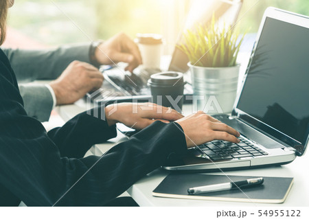 Businessman and businesswoman working in office. 54955122