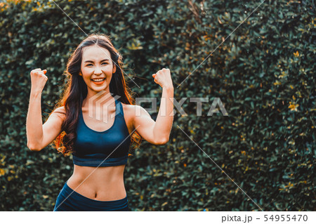 Young sport woman doing morning exercise in park. Young sport woman doing morning exercise in park. 54955470