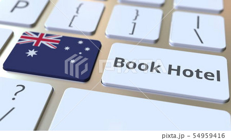 BOOK HOTEL text and flag of Australia on the buttons on the computer keyboard. Travel related BOOK HOTEL text and flag of Australia on the buttons on the computer keyboard. Travel related 54959416