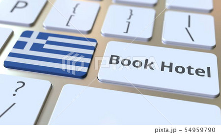 BOOK HOTEL text and flag of Greece on the buttons on the computer keyboard. Travel related BOOK HOTEL text and flag of Greece on the buttons on the computer keyboard. Travel related 54959790