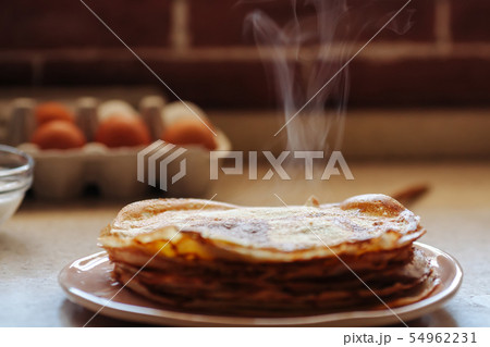 Stack of hot classic Russian thin pancakes. Rustic style. Traditional for the Russian pancake week - 54962231