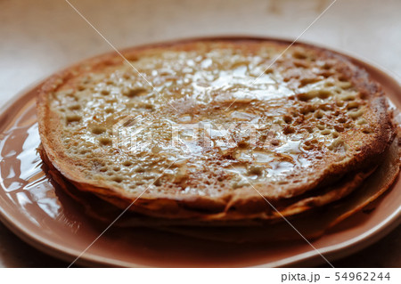 Stack of hot classic Russian thin pancakes. Rustic style. Traditional for the Russian pancake week - Stack of hot classic Russian thin pancakes. Rustic style. Traditional for the Russian pancake week - 54962244