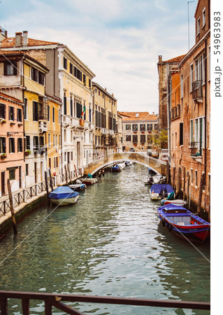 Beautiful venetian street in summer day, Italy 54963983