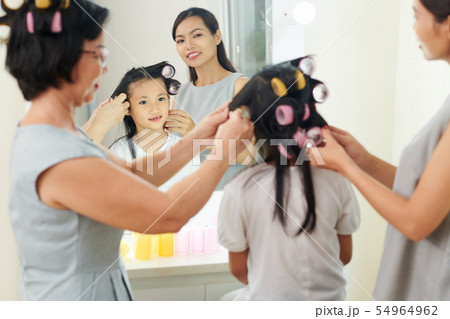 Family preparing for holiday event Family preparing for holiday event 54964962