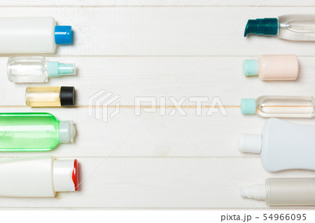 Top view of different cosmetic bottles and 54966095
