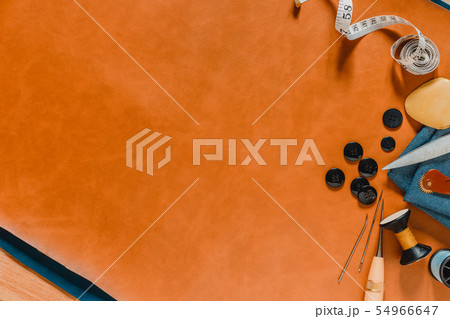Crafting tools on natural leather on background. 54966647