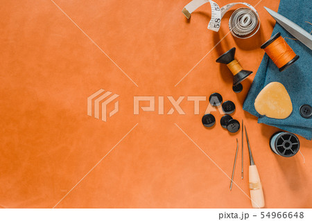 Crafting tools on natural leather on background. 54966648