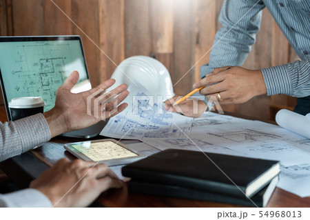 Confident engineer team working with Blue Print 54968013