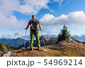 hiker with backpack is stand on mountain top 54969214