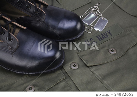 U.S. Navy Branch Tape with dog tags on olive green U.S. Navy Branch Tape with dog tags on olive green 54972055