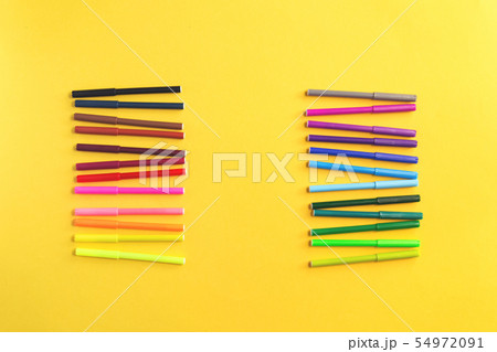 Colored rainbow gradient markers rows on yellow Colored rainbow gradient markers rows on yellow 54972091