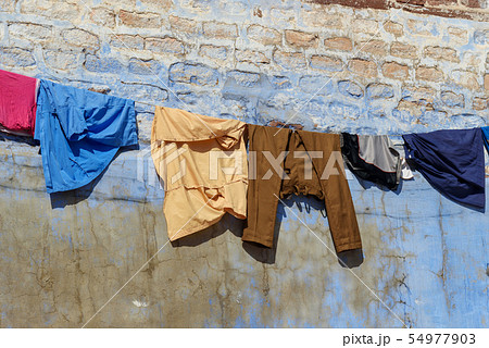 Clothes dry on rope on blue street of the Blue Clothes dry on rope on blue street of the Blue 54977903