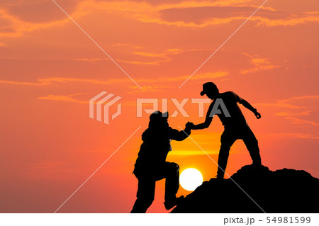 Silhouette of man hold up hands on the peak of 54981599