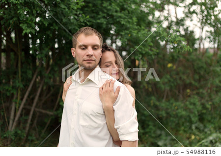 Young loving couple hugging and dancing on the Young loving couple hugging and dancing on the 54988116
