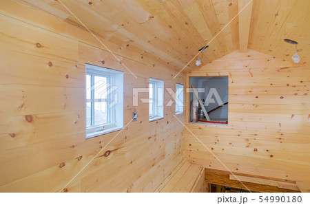 Empty room in a new wooden house under Empty room in a new wooden house under 54990180