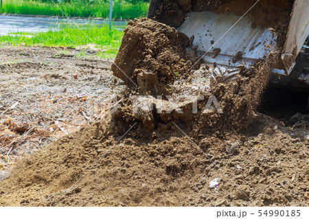 Earth moving by a bulldozer in the construction of 54990185