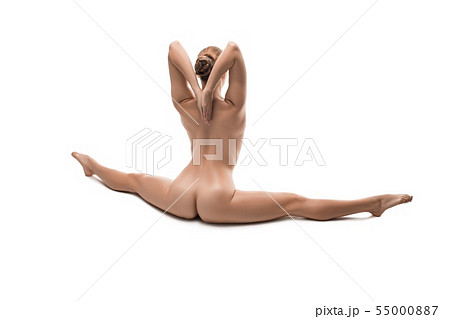 Woman in the nude sitting in a split isolated view 55000887
