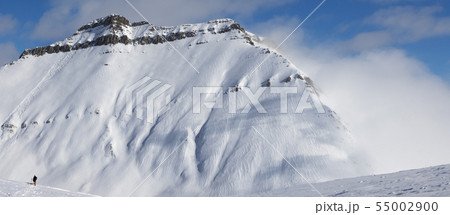 Skiers and off-piste slope with traces of skis, 55002900