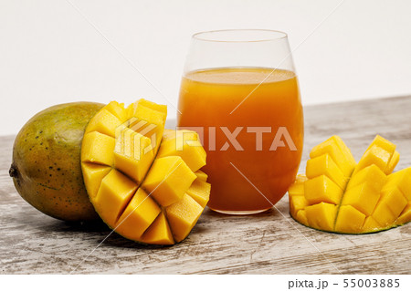 ripe juicy mango and fresh mango juice 55003885