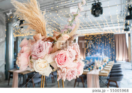 Wedding Banquet or gala dinner. The chairs and table for guests, served with cutlery and crockery Wedding Banquet or gala dinner. The chairs and table for guests, served with cutlery and crockery 55005968