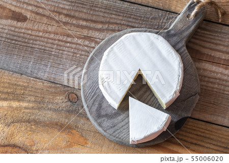 Camembert cheese on the wooden board 55006020