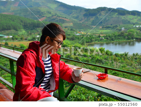 A young man at mountain view coffee shop A young man at mountain view coffee shop 55012560