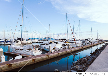 Luxury yachts docked in marina. 55012634