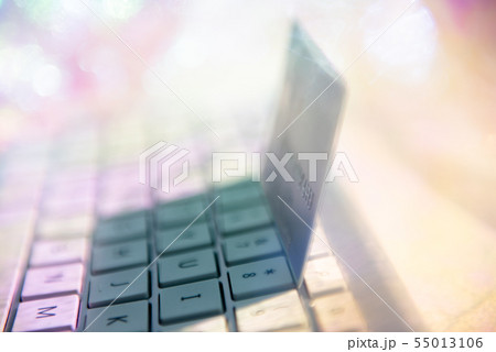 Credit card on computer keyboard Credit card on computer keyboard 55013106