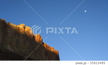 Moon over cliff in shadow in Capitol Reef National Park, USA 55013495