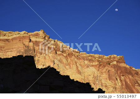Moon over cliff in shadow in Capitol Reef National Park, USA Moon over cliff in shadow in Capitol Reef National Park, USA 55013497