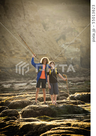 Teenage boys on rocks by tide pool in La Jolla, California Teenage boys on rocks by tide pool in La Jolla, California 55013623