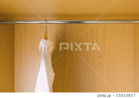 Shirts on clothes hangers in wardrobe Shirts on clothes hangers in wardrobe 55013657